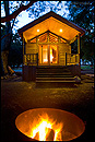 Photo: Rustic cabin and campfire, El Capitan Canyon Resort, California