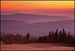 Photo: Golden sunset over forest and hills, Crater Lake National Park, Oregon