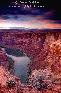 Sunset light on storm clouds over the Colorado River canyon, near Page, Arizona
