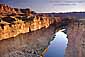 Sunrise light on cliffs above the Colorado River, from Navajo Bridge, Arizona