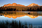 Chaos Crags and Mount Lassen at sunset reflected in Manzanita Lake, Lassen Volcanic National Park, California