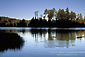 Circular ripples incalm waters of Manzanita Lake at sunrise, Lassen Volcanic National Park, California