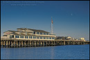Picture: Moon rising over shops and restaurants at Stearns Wharf, Santa Barbara, Southern Coast, California