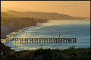 Picture: Golden sunrise light over coastal hills, pier, and beach at Gaviota Beach State Park, near Santa Barbara, California