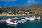 Picture: Couple in raft pull up to dock at Two Harbors, Catalina Island, California
