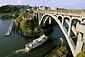 Picture: Boat passing under arch bridge at Depoe Bay, Central Oregon Coast