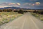 Picture: tire tracks on empty dirt road in the high desert near Santa Fe, New Mexico