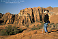 Image: Hiker overlooking red sandstone cliffs at Snow Canyon State Park, near St. George, Utah's Dixie, Utah