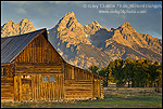 Sunrise light on the Grand teton mountain peak over old wooden barn, Mormon Row, Grand Teton National Park, Wyoming 